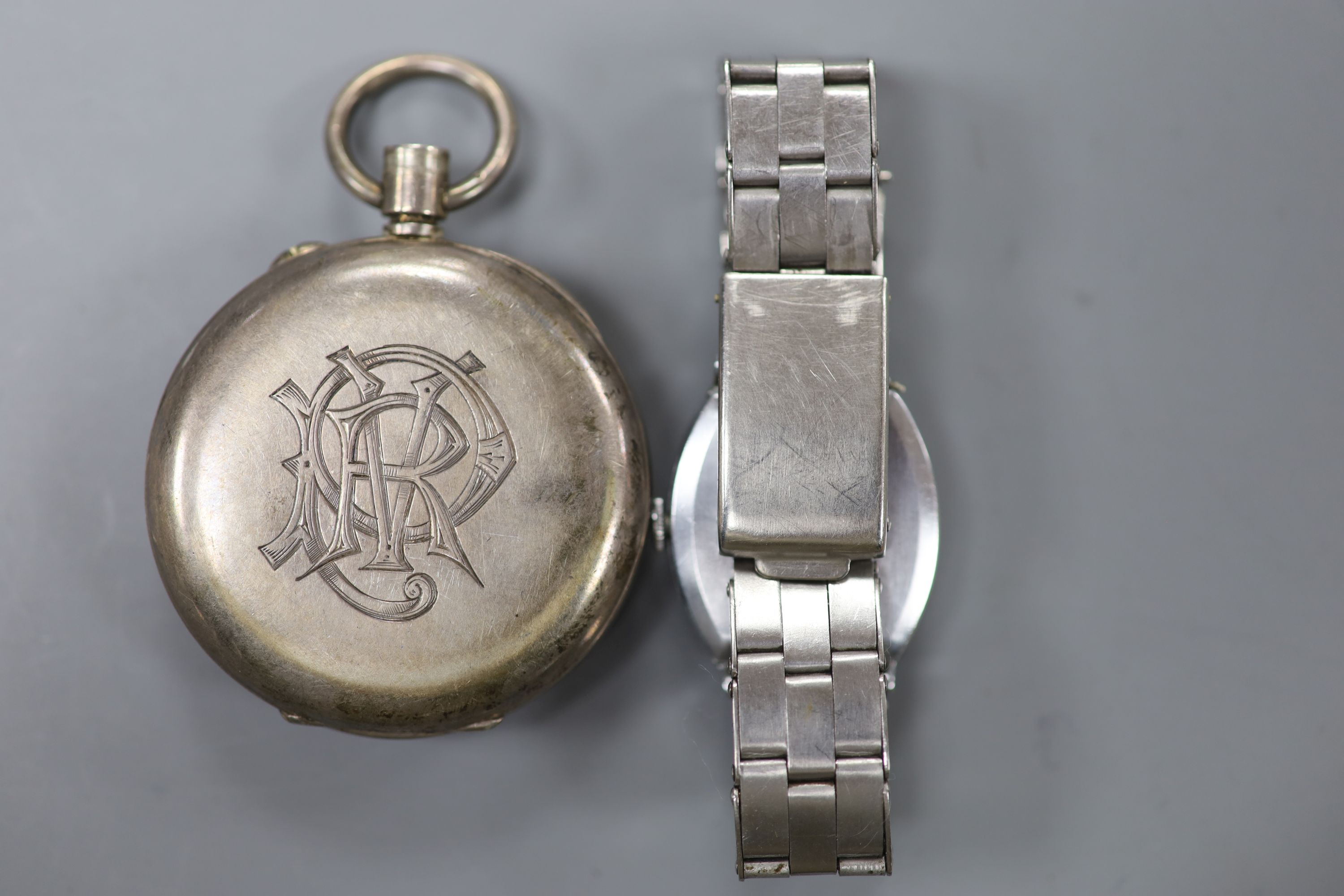 A 1930s Bulova plated wristwatch on later stainless steel bracelet and a Spikins from Dent Accuraspeed silver pocket chronograph (2)